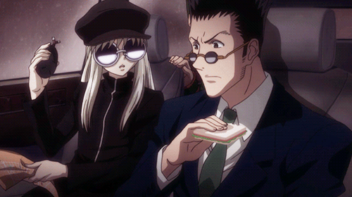 A clip from Hunter x Hunter where leorio eats a sandwhich in one bite before driving a car
